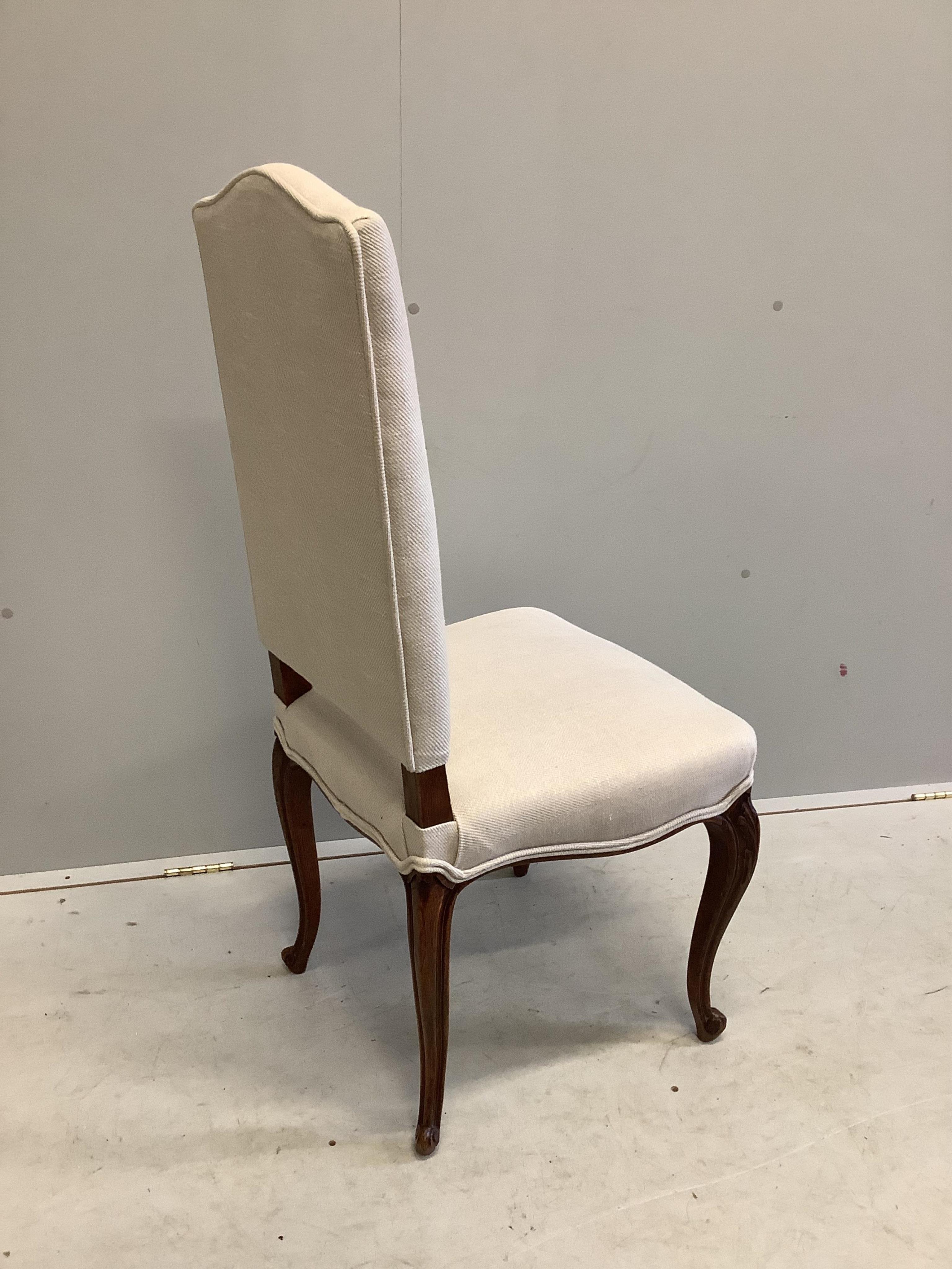 A set of eight 19th century French oak dining chairs, recently re-upholstered in a natural colour fabric, width 50cm, depth 46cm, height 106cm. Condition - good